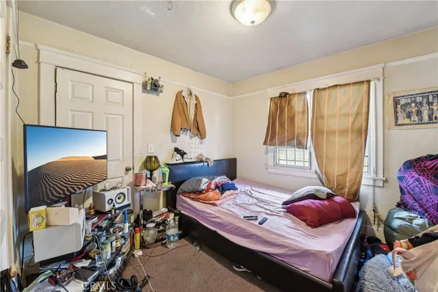 a bedroom with furniture and a bed