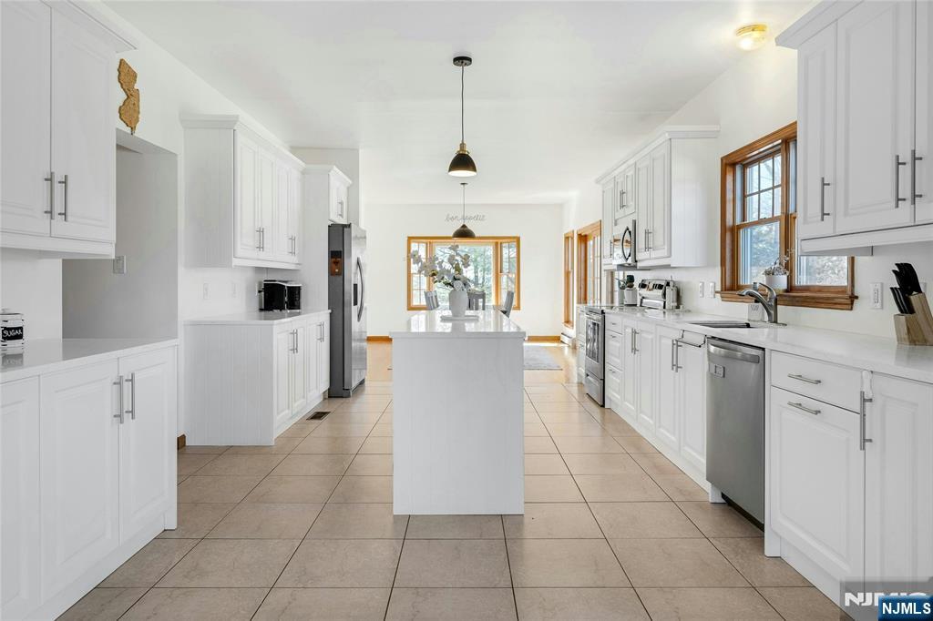 40 Horseneck Road Montville, NJ 07045 - Photo 17 of 47 a large kitchen with cabinets and wooden floor