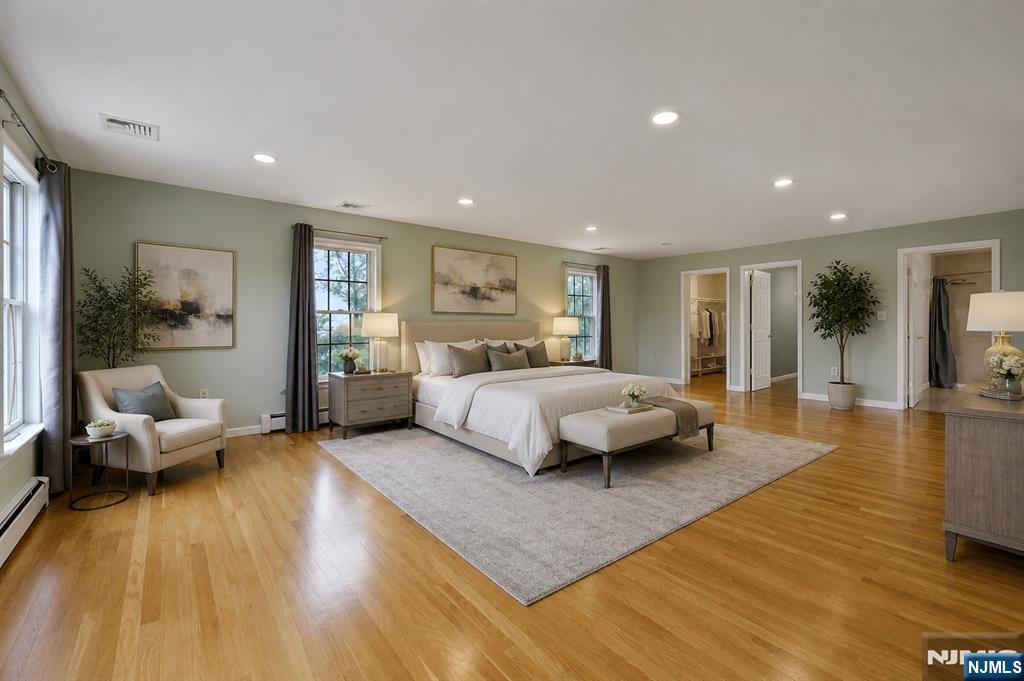 40 Horseneck Road Montville, NJ 07045 - Photo 23 of 47 a bedroom with a bed and wooden floor