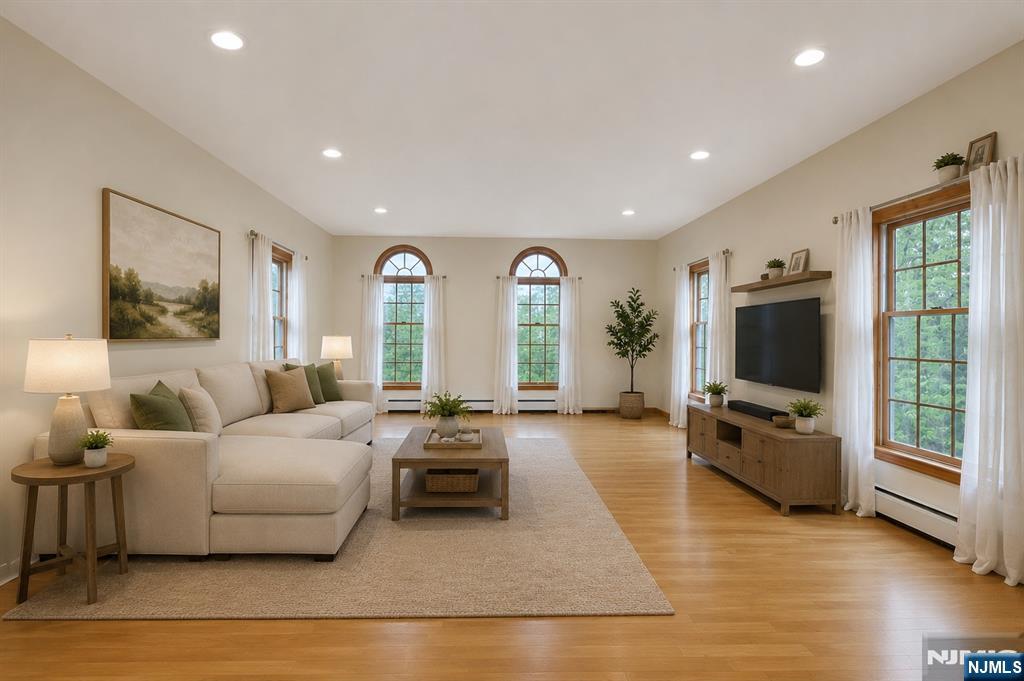 40 Horseneck Road Montville, NJ 07045 - Photo 25 of 47 a living room with furniture flat screen tv and large window