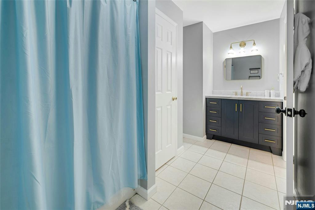 40 Horseneck Road Montville, NJ 07045 - Photo 34 of 47 a spacious bathroom with a mirror a sink and a shower