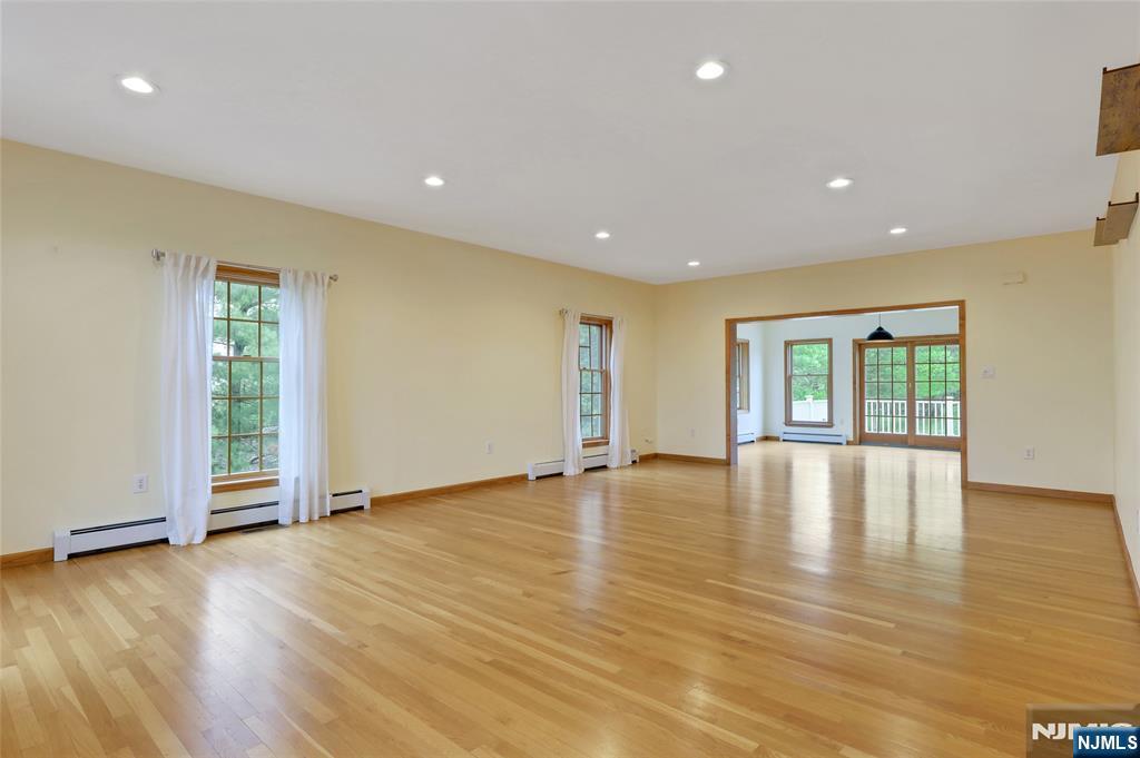 40 Horseneck Road Montville, NJ 07045 - Photo 38 of 47 a view of empty room with wooden floor and fireplace