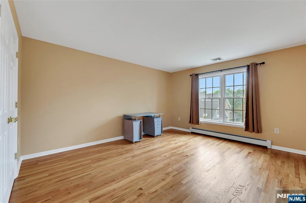 40 Horseneck Road Montville, NJ 07045 - Photo 41 of 47 a view of an empty room with wooden floor and a window