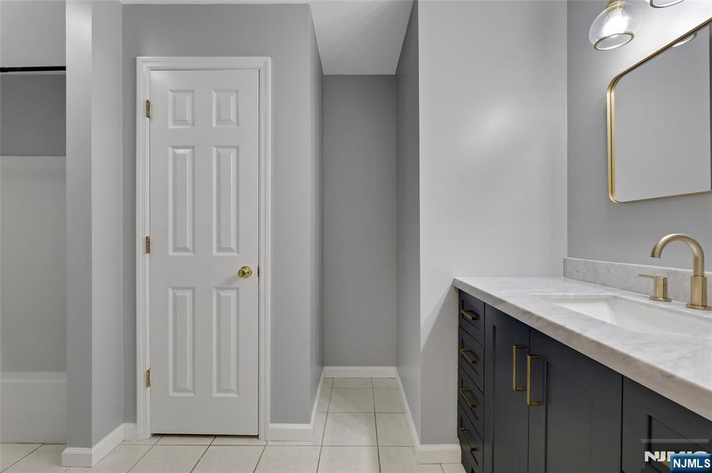 40 Horseneck Road Montville, NJ 07045 - Photo 43 of 47 a bathroom with a sink and a mirror