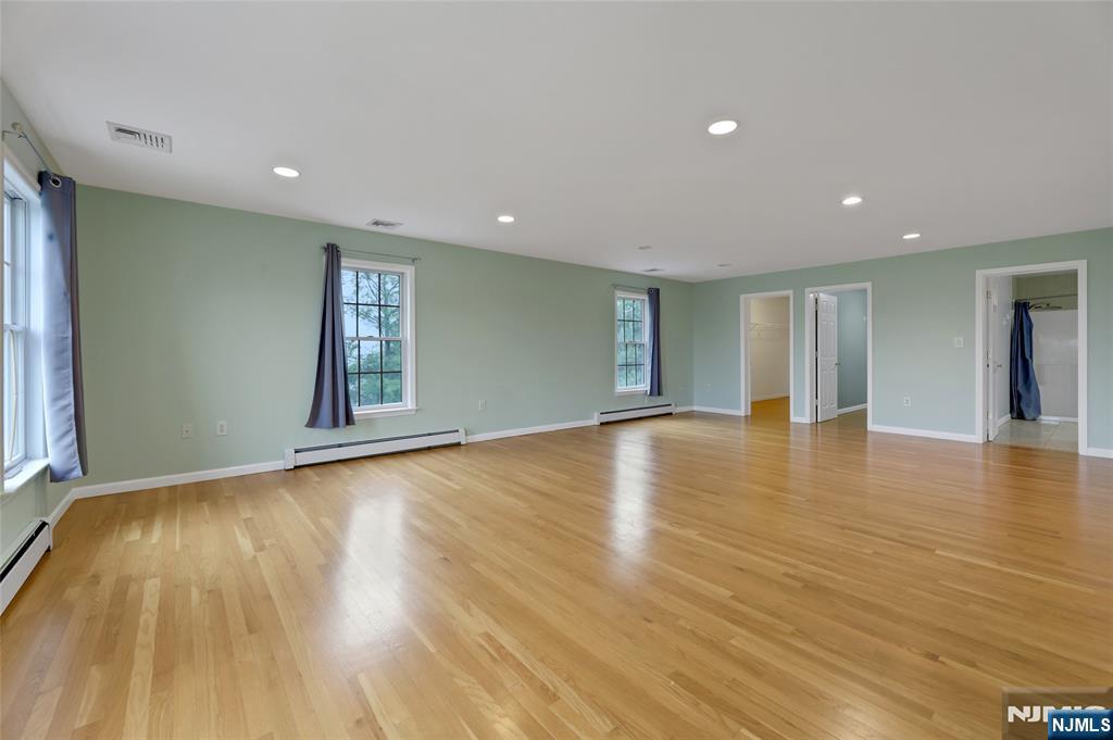 40 Horseneck Road Montville, NJ 07045 - Photo 45 of 47 a view of empty room with wooden floor and fan