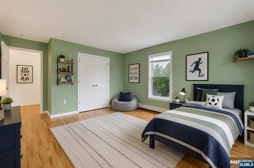 40 Horseneck Road Montville, NJ 07045 - Photo 46 of 47 a bedroom with a bed and wooden floor