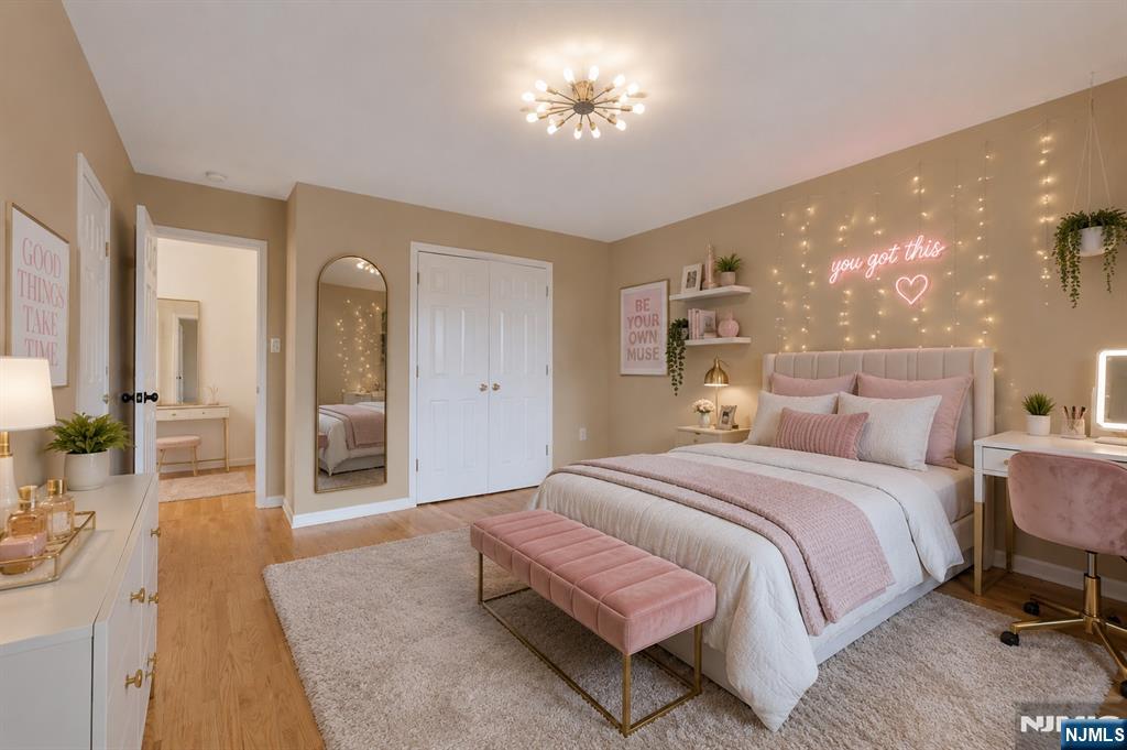 40 Horseneck Road Montville, NJ 07045 - Photo 47 of 47 a spacious bedroom with a bed and a chandelier