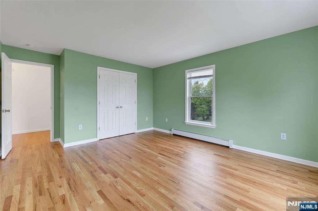 40 Horseneck Road Montville, NJ 07045 - Photo 6 of 47 a view of an empty room with wooden floor and a window