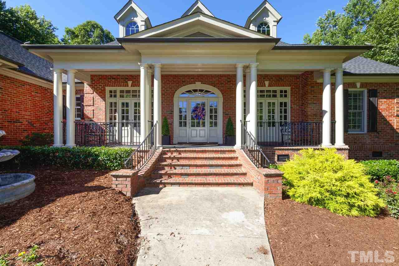 1420 Wynncrest Court Raleigh, NC 27603 - Photo 2 of 30 a front view of a house with garden