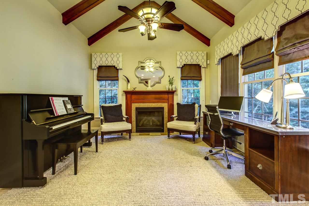 1420 Wynncrest Court Raleigh, NC 27603 - Photo 12 of 30 a view of a livingroom with furniture and a fireplace