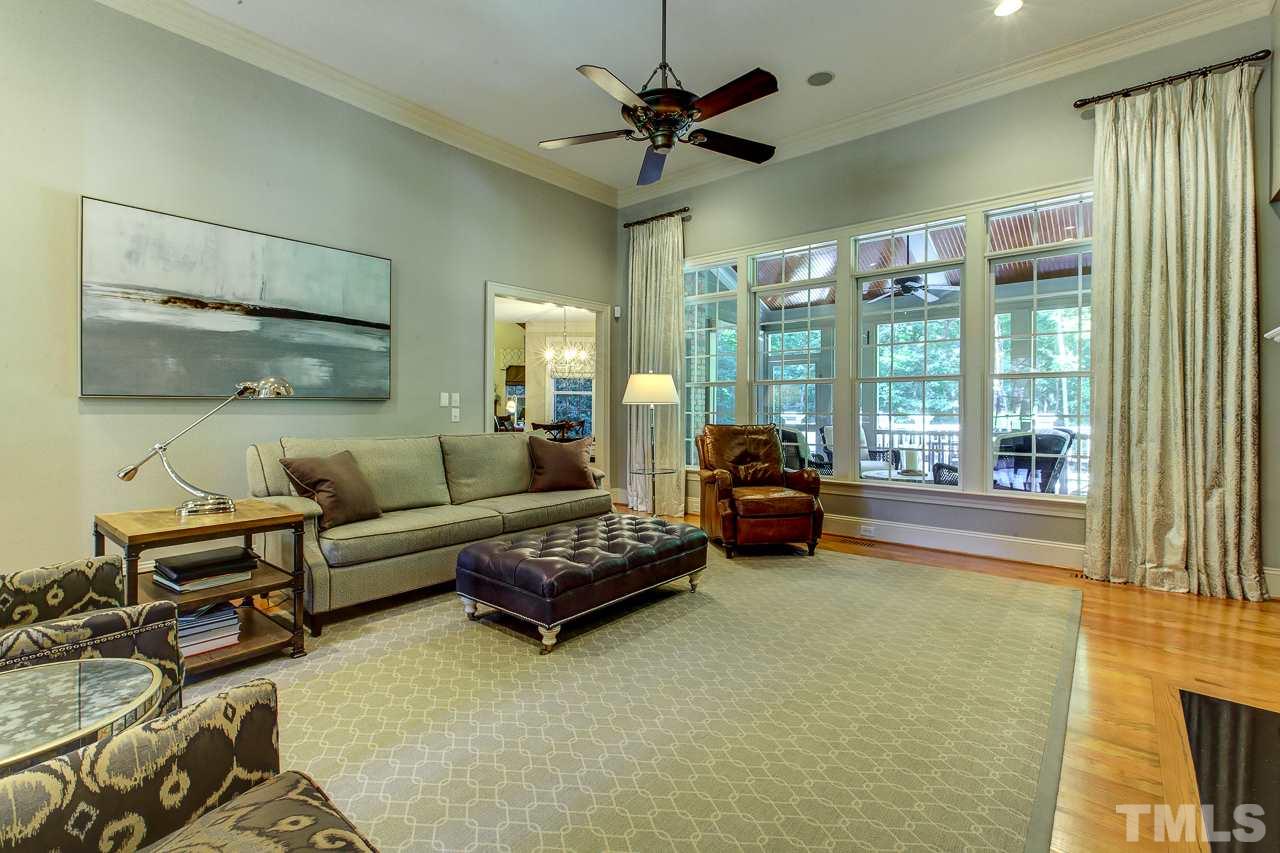 1420 Wynncrest Court Raleigh, NC 27603 - Photo 15 of 30 a living room with furniture and a large window with garden view
