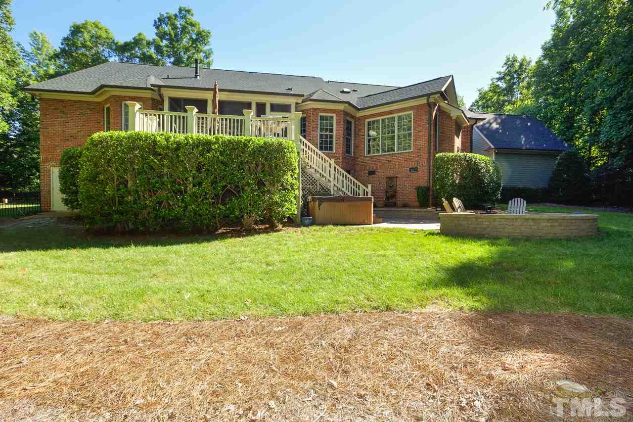 1420 Wynncrest Court Raleigh, NC 27603 - Photo 28 of 30 a front view of a house with a yard and potted plants