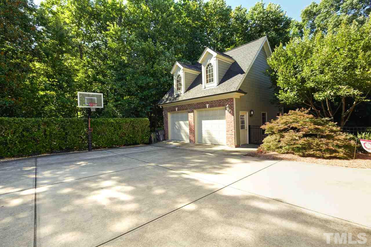 1420 Wynncrest Court Raleigh, NC 27603 - Photo 29 of 30 a front view of a house with a yard and garage