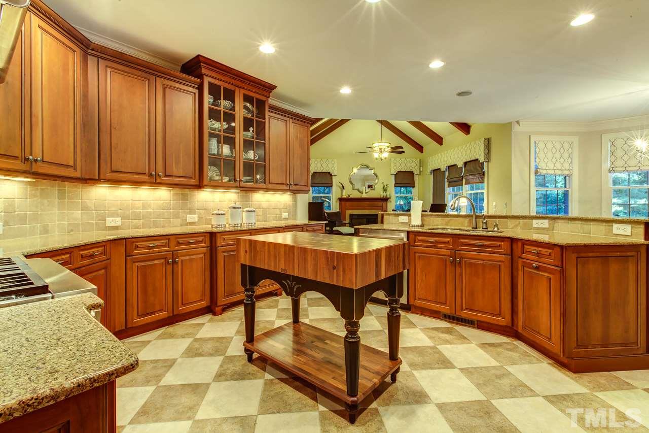 1420 Wynncrest Court Raleigh, NC 27603 - Photo 7 of 30 a kitchen with a sink cabinets and window