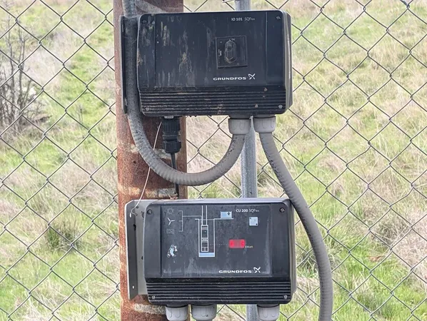 a fire hydrant in the middle of a field