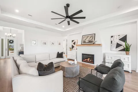 a living room with furniture a fireplace