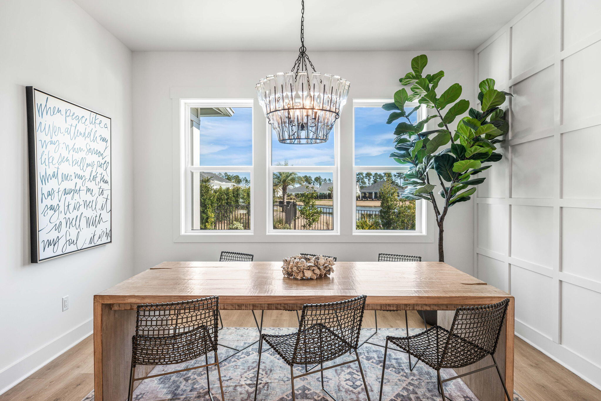 425 Lafayette Road Watersound, FL 32461 - Photo 15 of 52 a dining room with furniture a chandelier and window