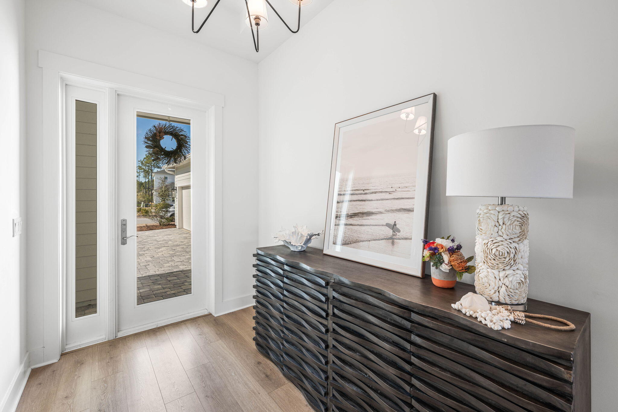 425 Lafayette Road Watersound, FL 32461 - Photo 18 of 52 a room with wooden floor table and a window