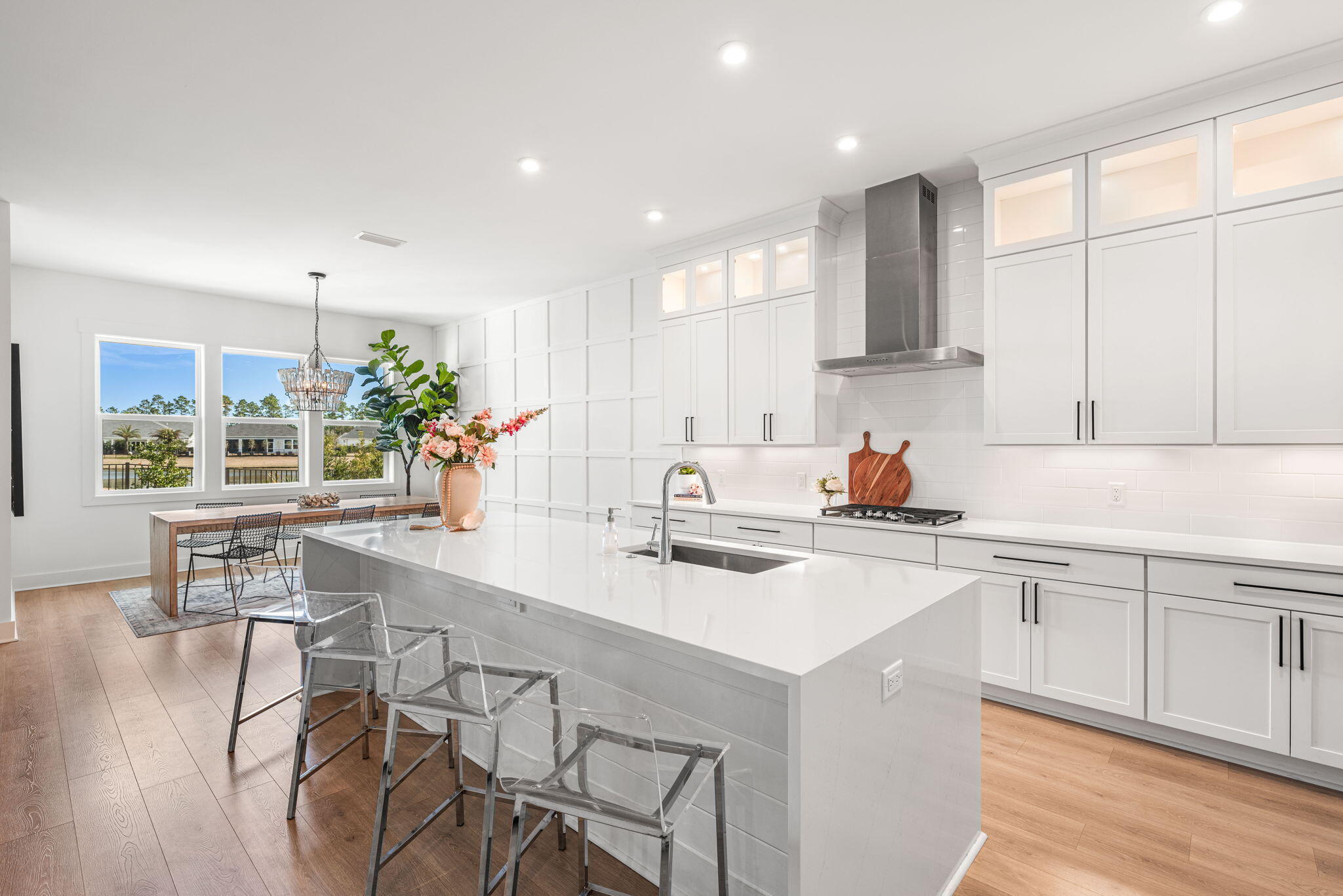 425 Lafayette Road Watersound, FL 32461 - Photo 2 of 52 a kitchen with a table chairs stove and cabinets