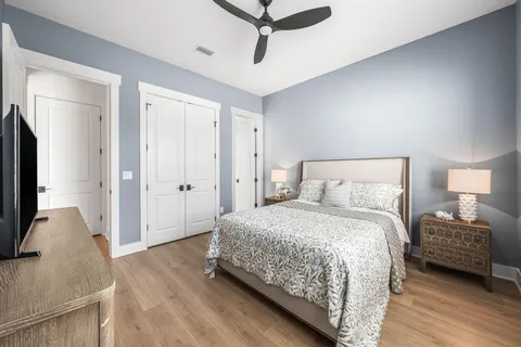 a bedroom with a bed and a flat screen television
