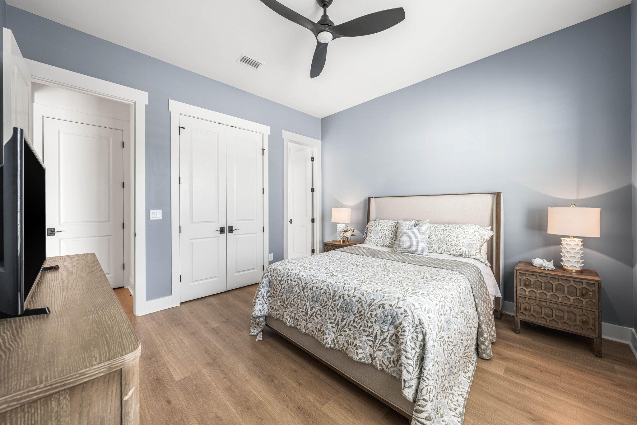 425 Lafayette Road Watersound, FL 32461 - Photo 31 of 52 a bedroom with a bed and a flat screen television