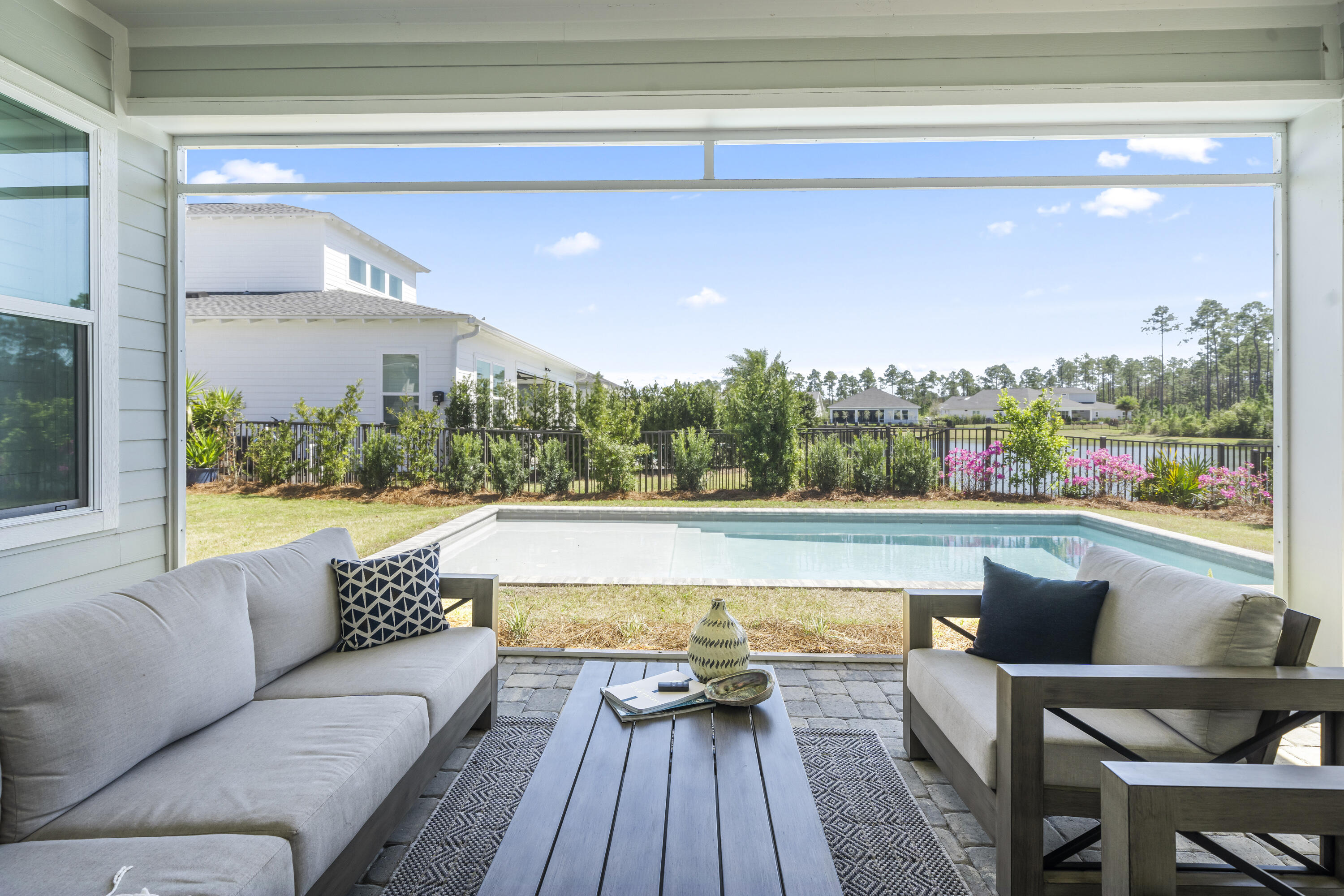 425 Lafayette Road Watersound, FL 32461 - Photo 44 of 52 a living room with dining room and wooden floor