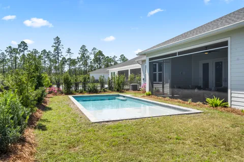 a view of swimming pool with sitting area