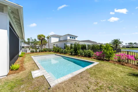 a view of swimming pool with outdoor seating