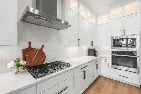 a kitchen with cabinets and appliances
