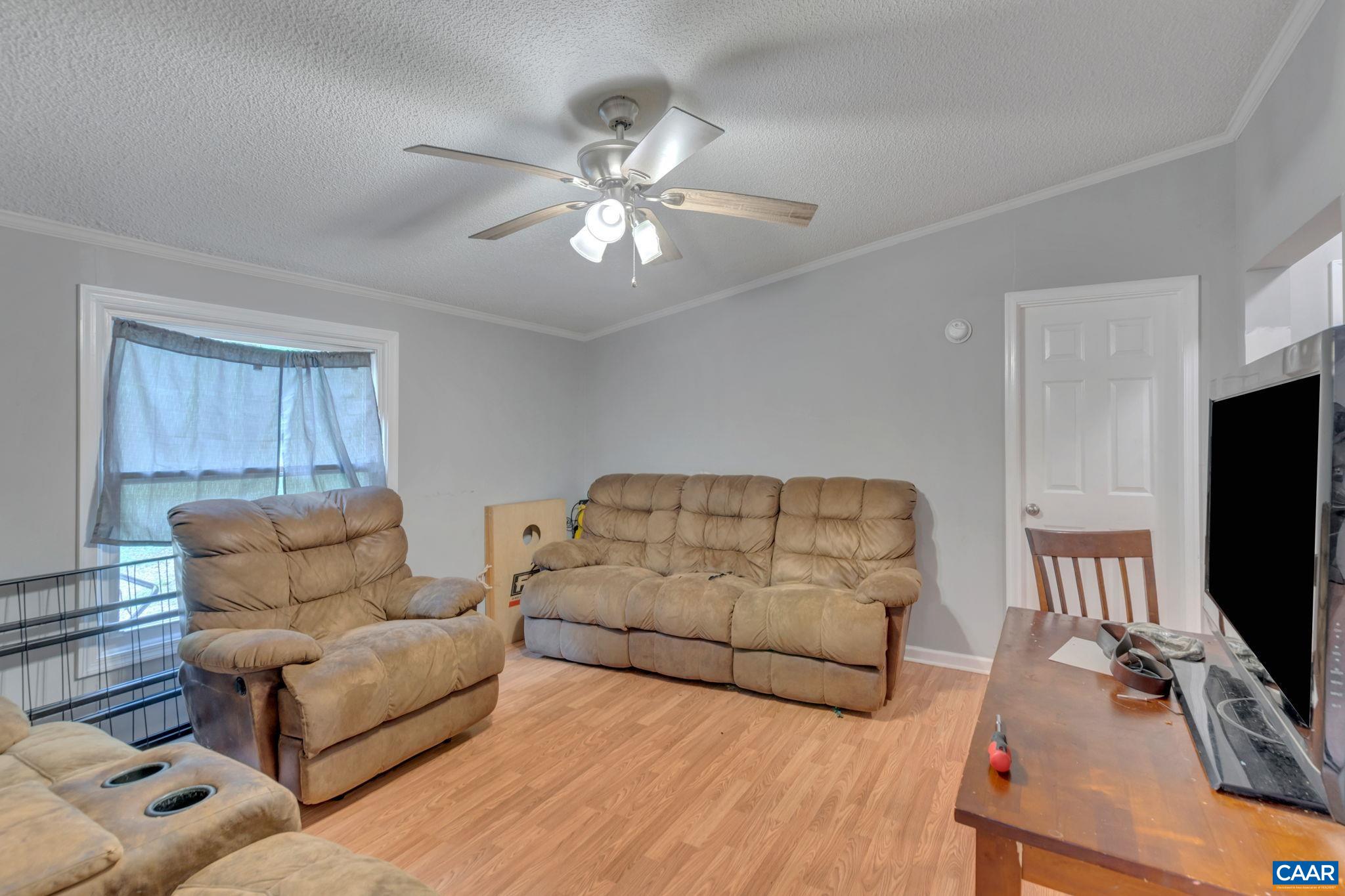 1826 Adial Road Faber, VA 22938 - Photo 21 of 39 a living room with furniture and a flat screen tv
