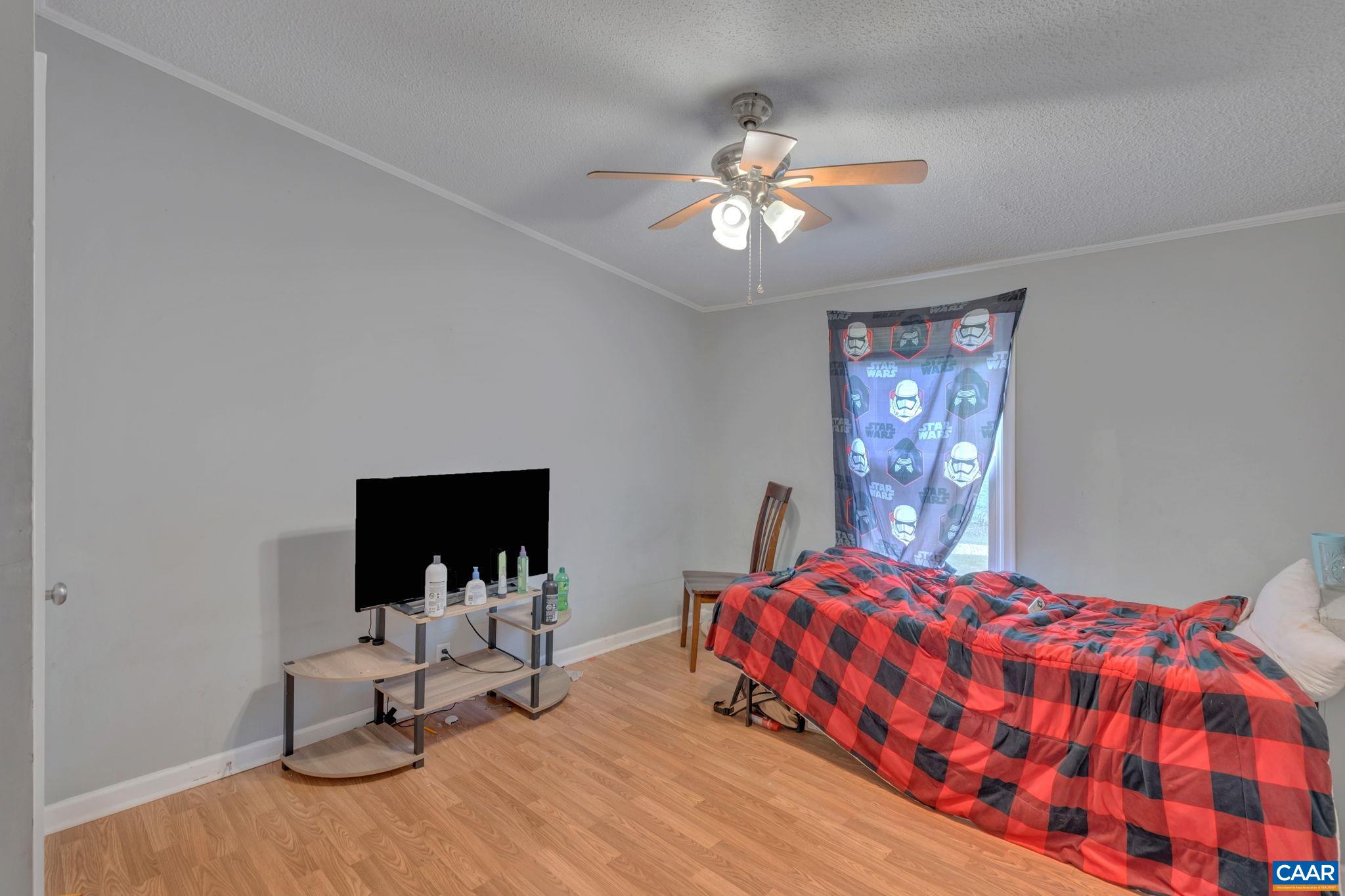 1826 Adial Road Faber, VA 22938 - Photo 25 of 39 a bedroom with a bed and glass wall