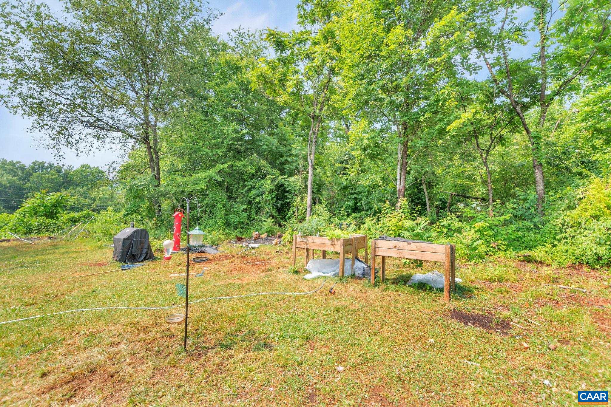 1826 Adial Road Faber, VA 22938 - Photo 34 of 39 a view of a backyard with table and chairs
