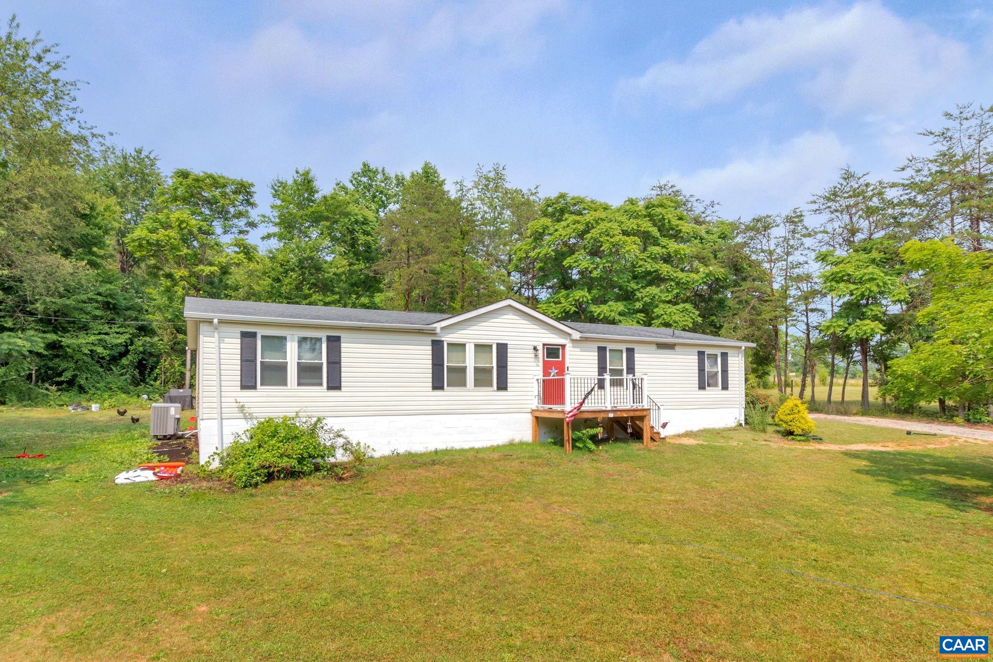 1826 Adial Road Faber, VA 22938 - Photo 38 of 39 a front view of a house with a garden and trees