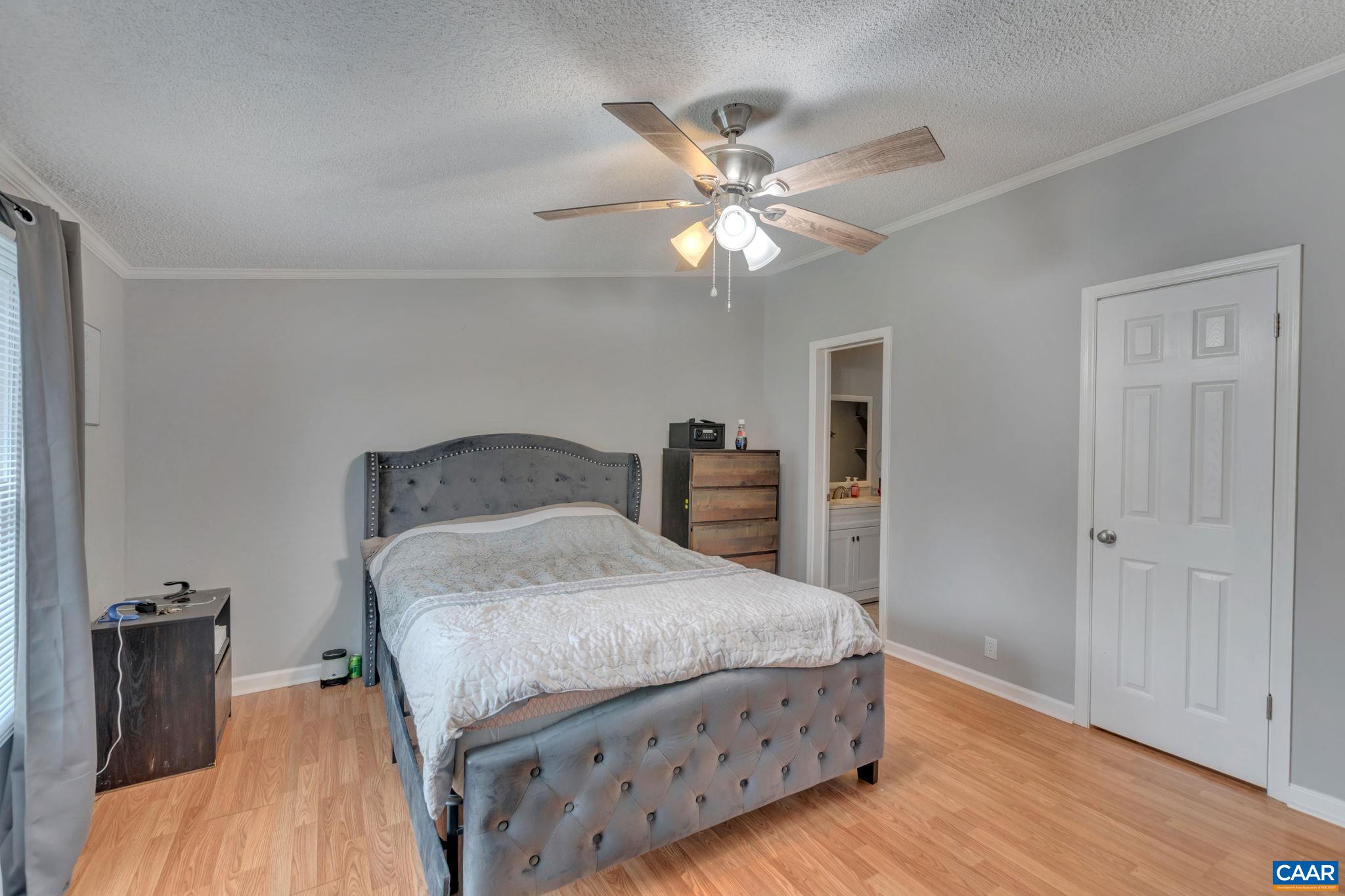 1826 Adial Road Faber, VA 22938 - Photo 8 of 39 a bedroom with a bed and wooden floor