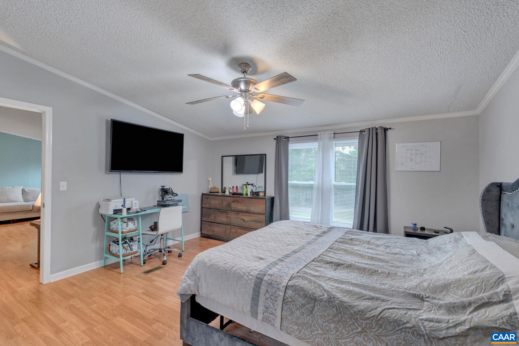 1826 Adial Road Faber, VA 22938 - Photo 9 of 39 a bedroom with a bed and a flat screen tv