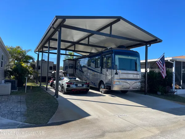 a view of a car park in front of house