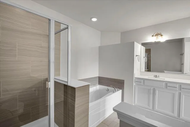 a bathroom with a bathtub and a sink