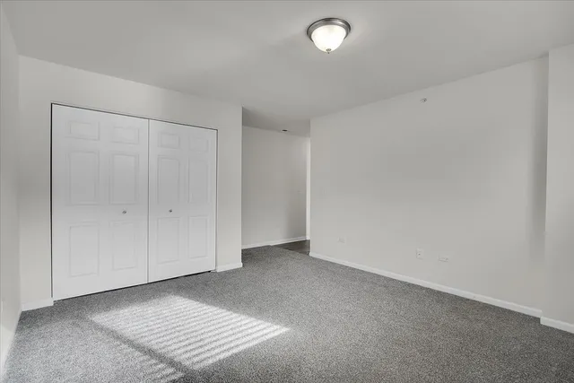an empty room with white walls