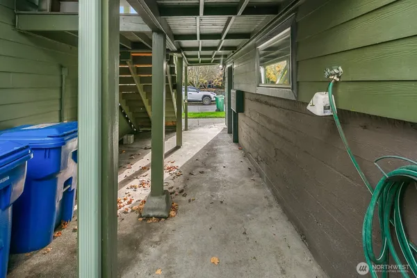 a view of a pathway of a house with backyard