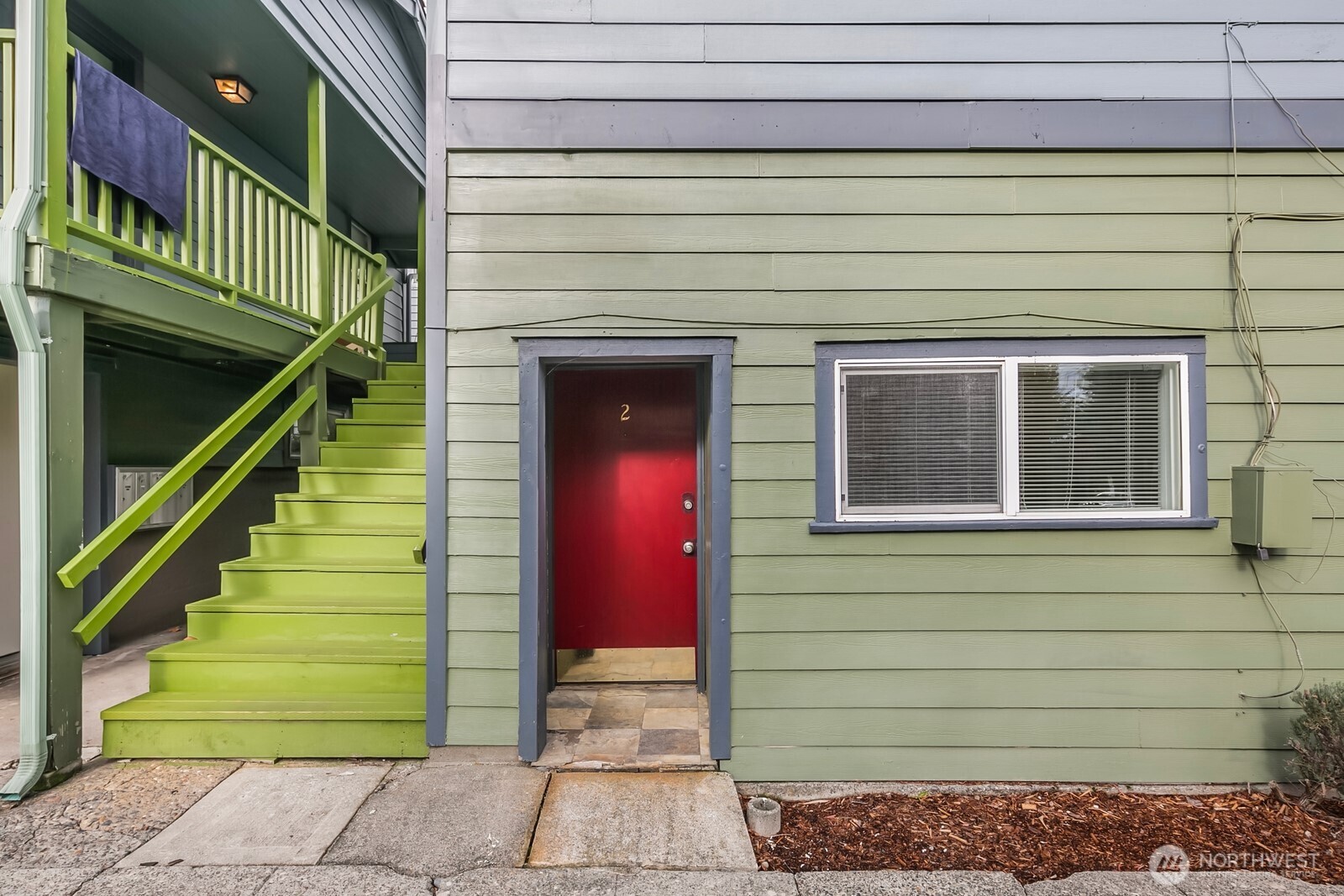 7103 Linden Avenue North, Unit 15 Seattle, WA 98103 - Photo 14 of 40 a front view of a house with a garden