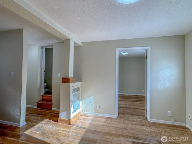 a kitchen with stainless steel appliances a refrigerator and a stove top oven