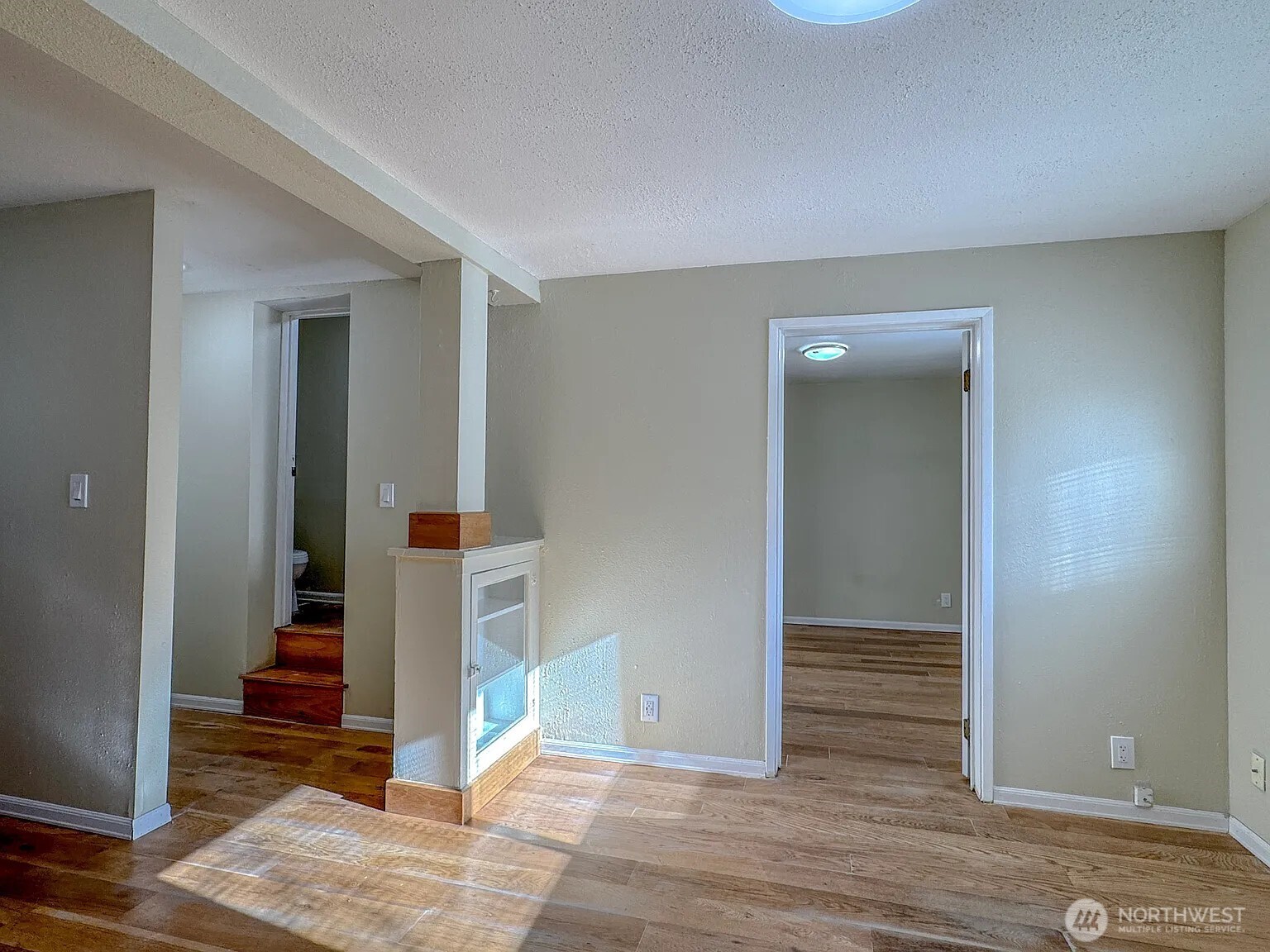 7103 Linden Avenue North, Unit 15 Seattle, WA 98103 - Photo 16 of 40 wooden floor in a hall with an entryway and a living room