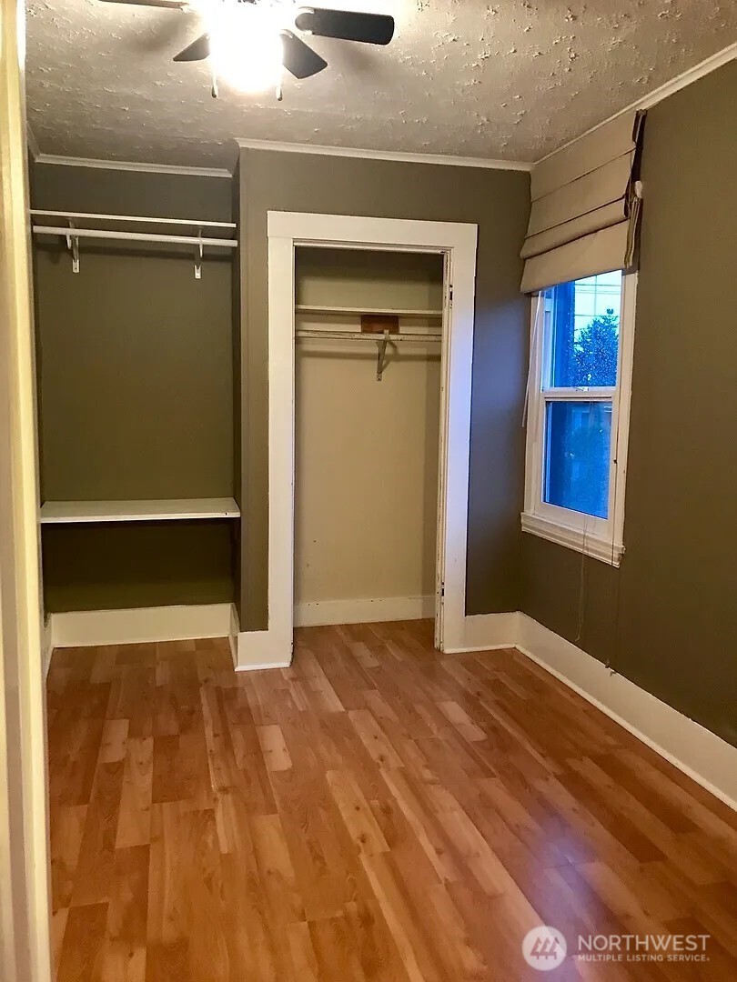 7103 Linden Avenue North, Unit 15 Seattle, WA 98103 - Photo 25 of 40 a view of an empty room with closet and a window