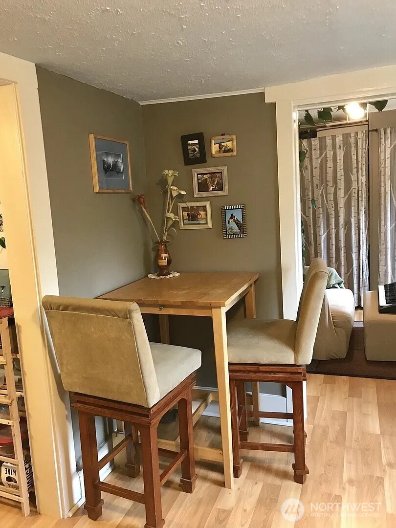 7103 Linden Avenue North, Unit 15 Seattle, WA 98103 - Photo 26 of 40 a view of a livingroom with furniture and window
