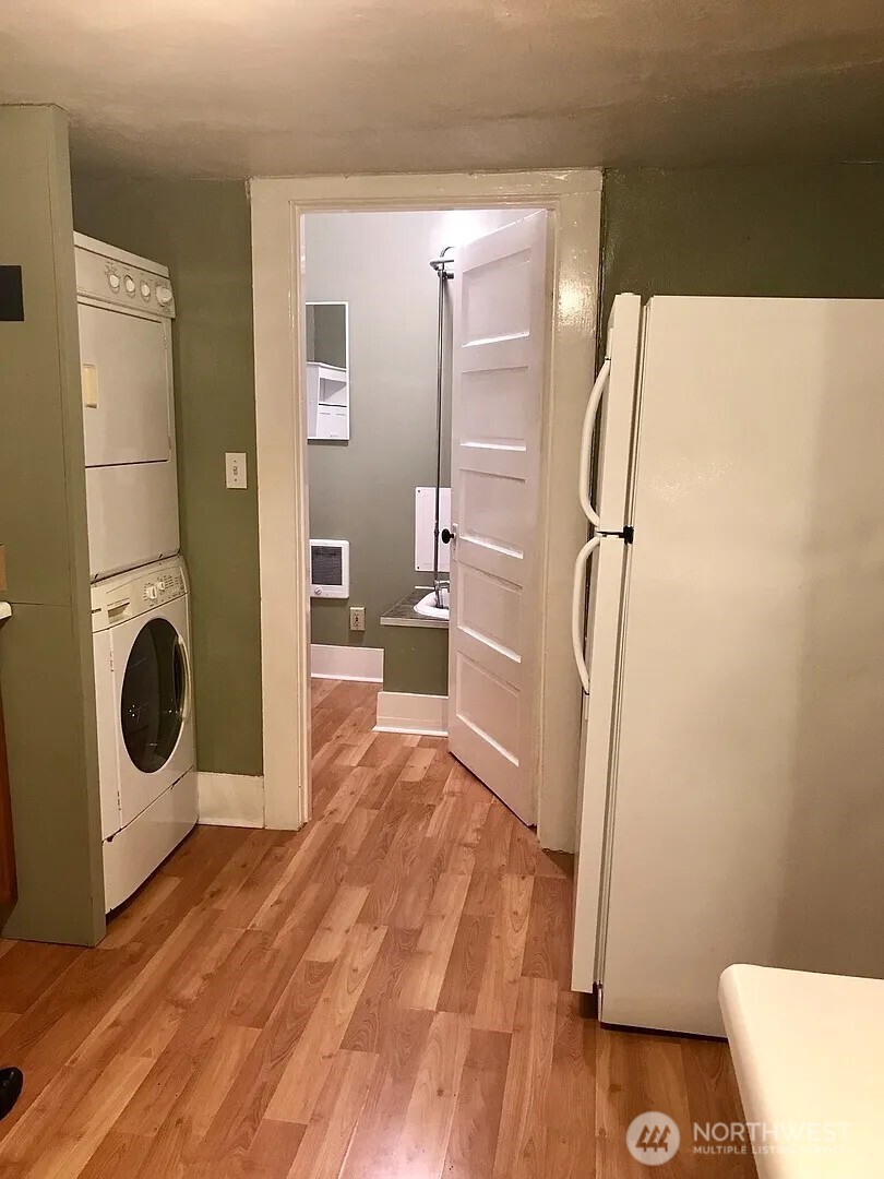 7103 Linden Avenue North, Unit 15 Seattle, WA 98103 - Photo 28 of 40 a view of a kitchen with a refrigerator and washer