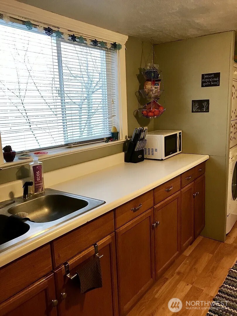7103 Linden Avenue North, Unit 15 Seattle, WA 98103 - Photo 29 of 40 a kitchen with a sink and a window