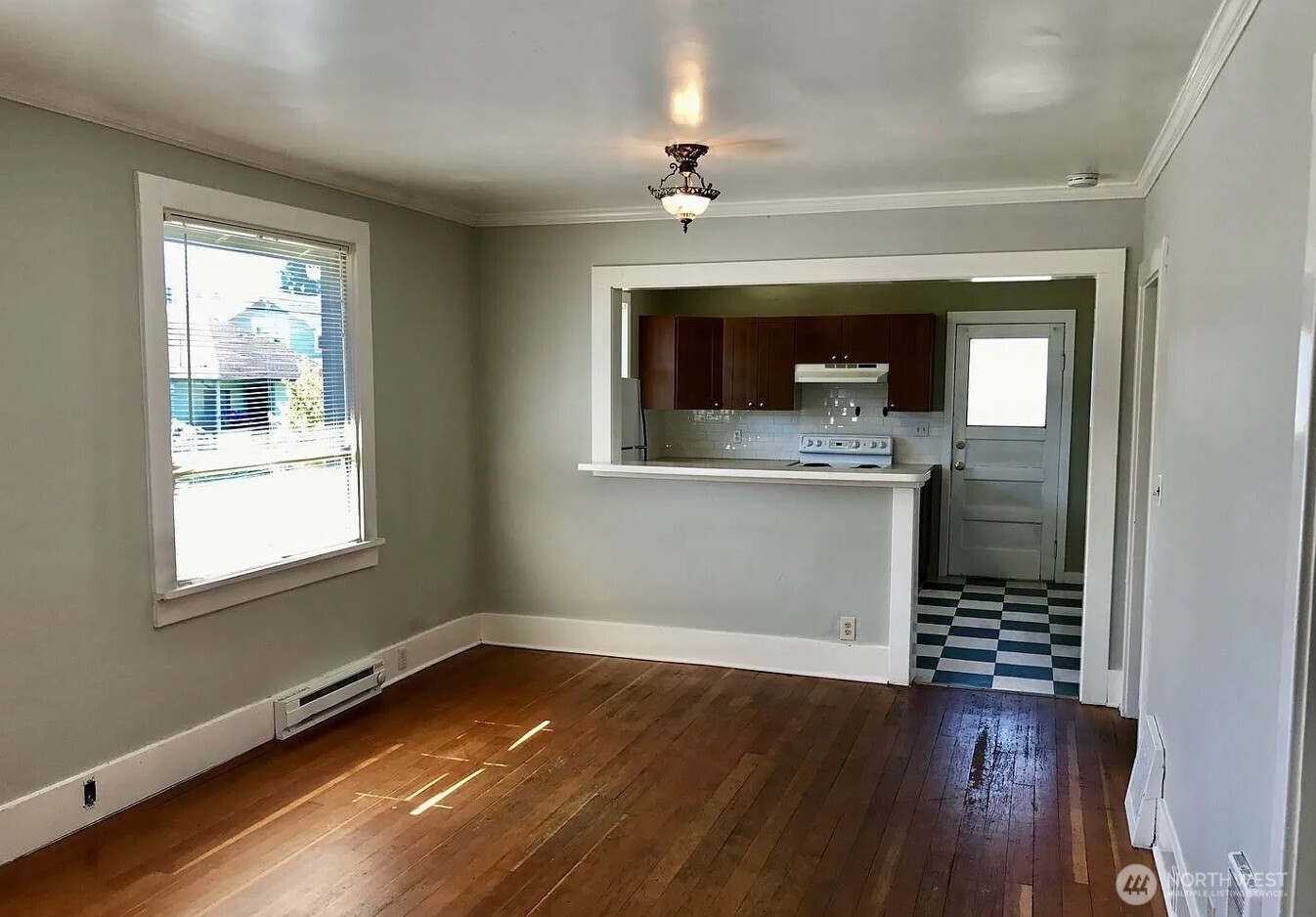 7103 Linden Avenue North, Unit 15 Seattle, WA 98103 - Photo 33 of 40 wooden floor in an empty room with a window
