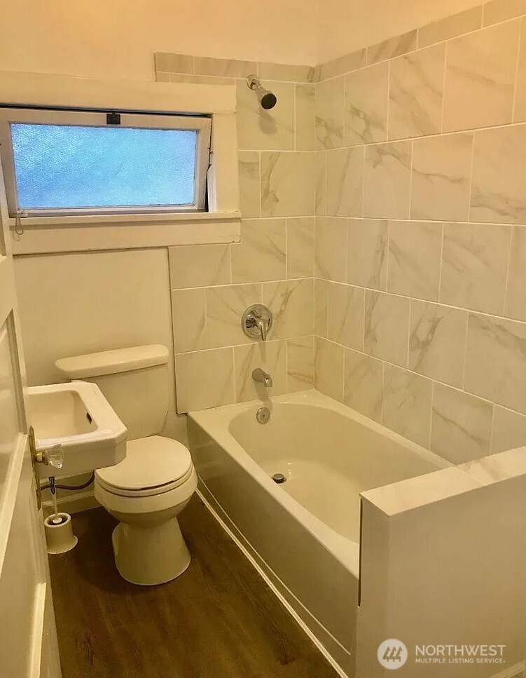 7103 Linden Avenue North, Unit 15 Seattle, WA 98103 - Photo 36 of 40 a bathroom with a sink and a toilet