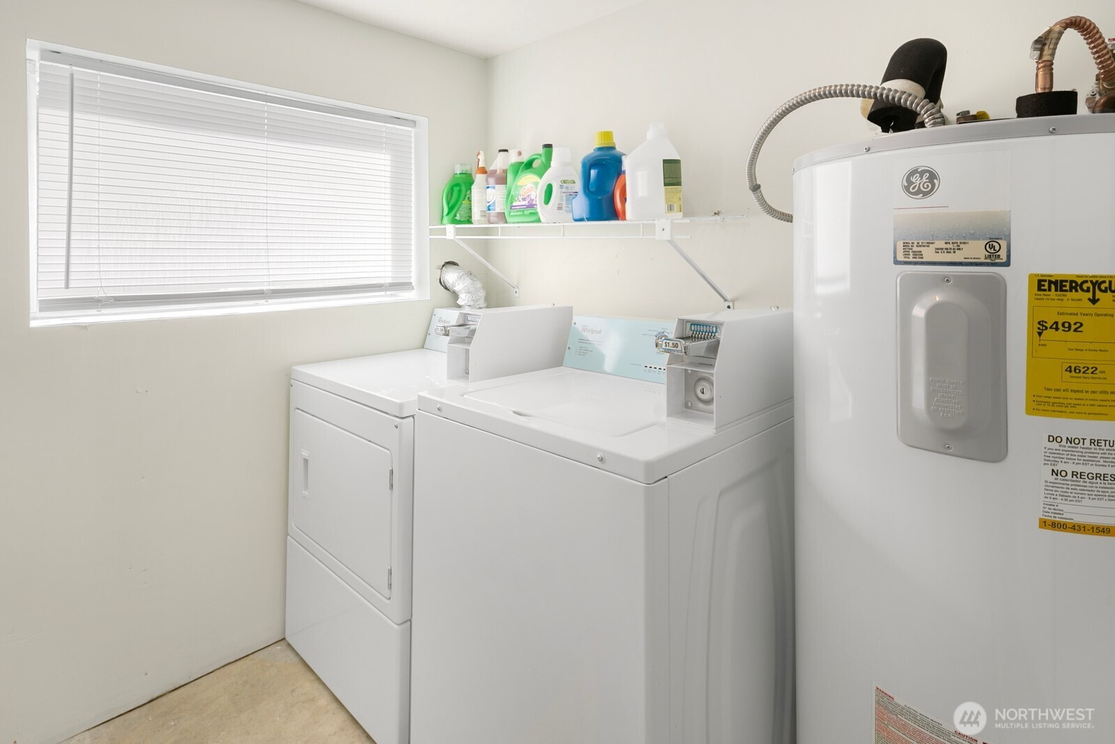 7103 Linden Avenue North, Unit 15 Seattle, WA 98103 - Photo 9 of 40 a utility room with dryer and washer