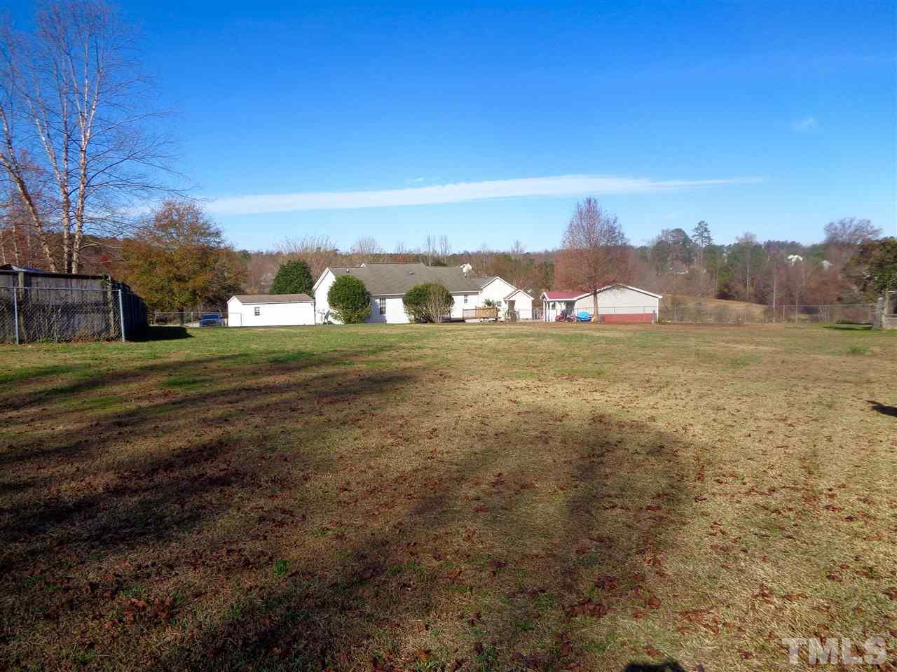 109 Holly Ranch Court Willow Spring, NC 27592 - Photo 22 of 25 In this fenced yard you would never have to worry about not having enough room for the kids to play.